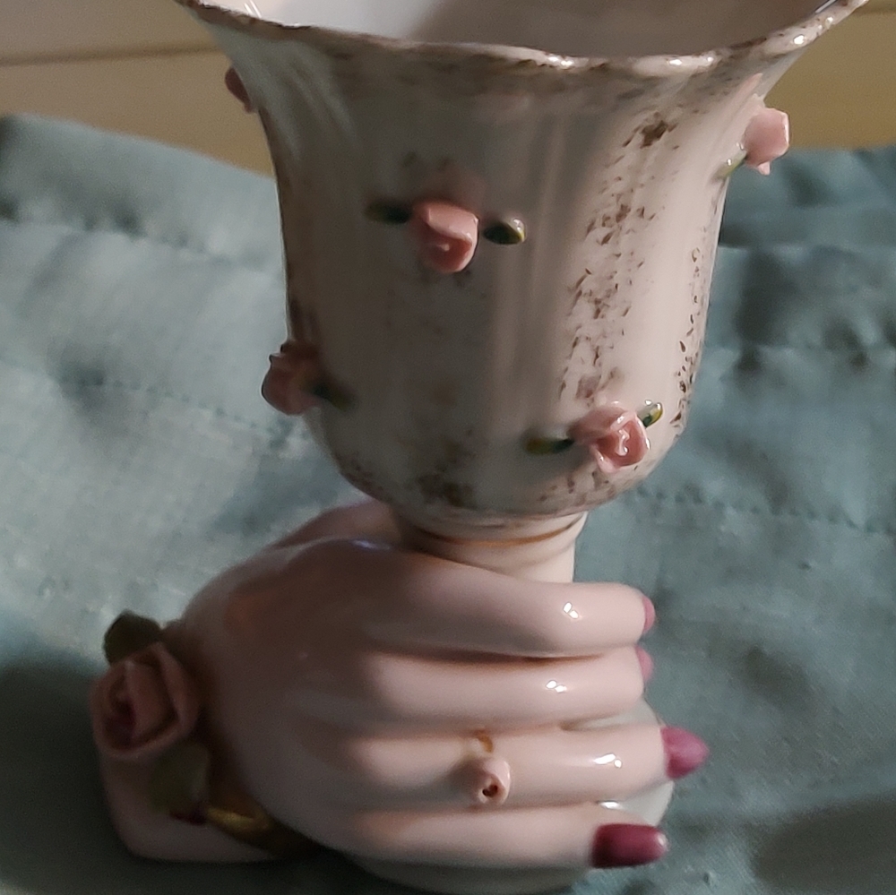 Vintage vase with hand